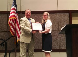 M McClam presenting Marty Mobley with NSPE Fellow